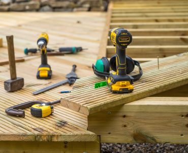 Image of joists, planks and tools on a low level deck being constructed