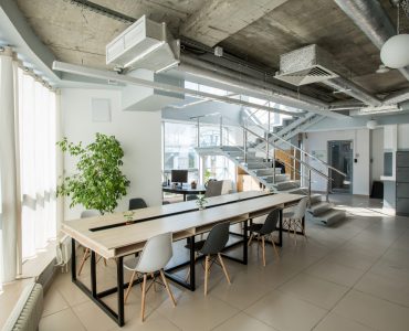 Light business office with modern interior and big windows